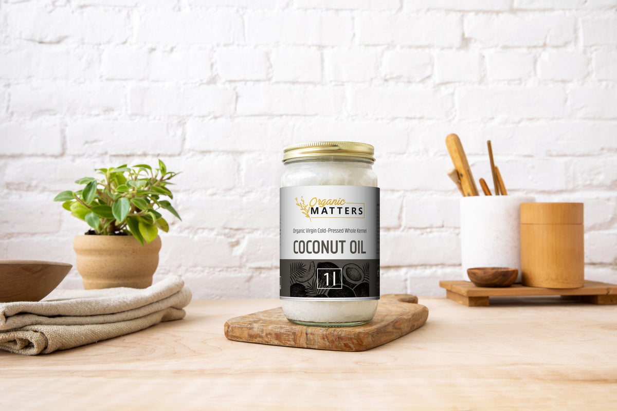 Organic Matters Coconut Oil Whole Kernel jar on a kitchen counter