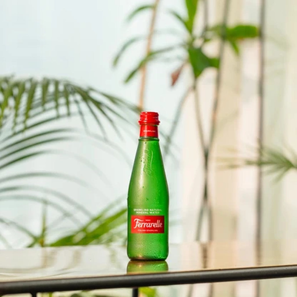 Ferrarelle Sparkling 33cl bottle with palm leaves